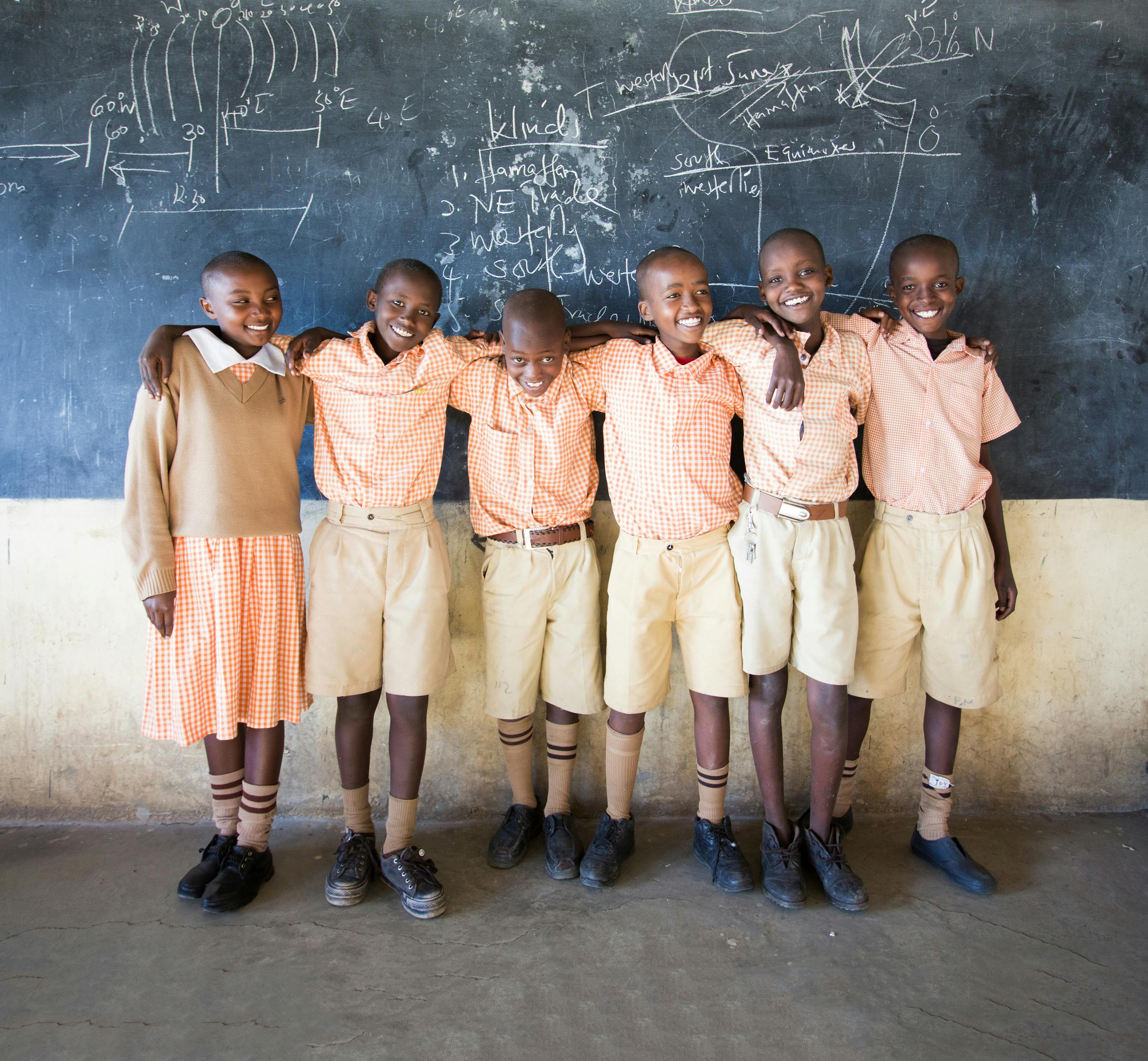 Group of school students standing in a row