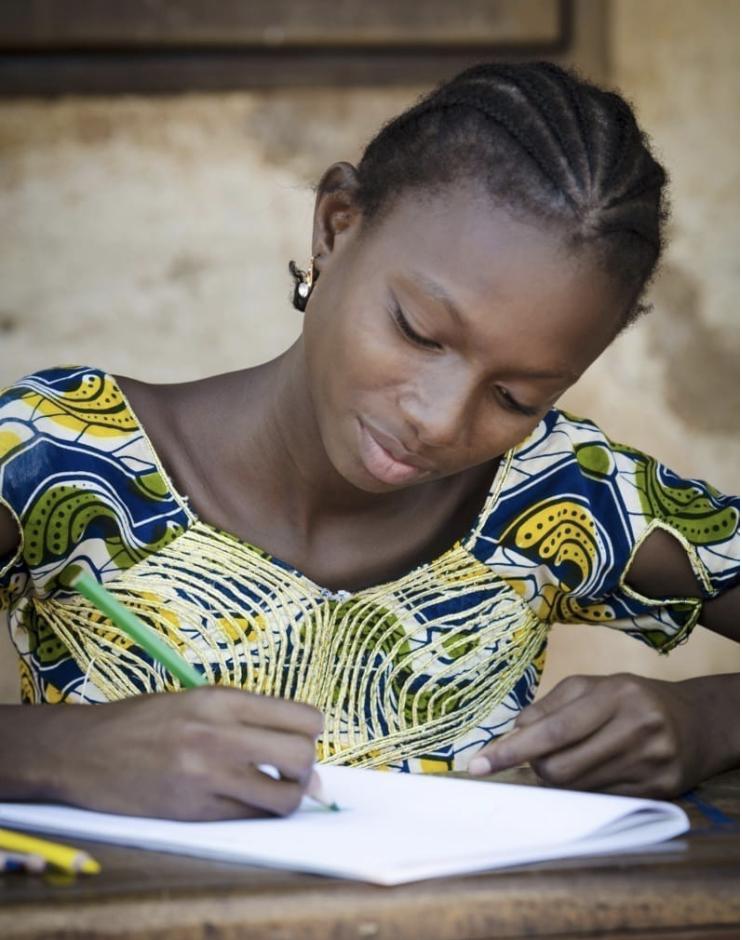 Young girl writing