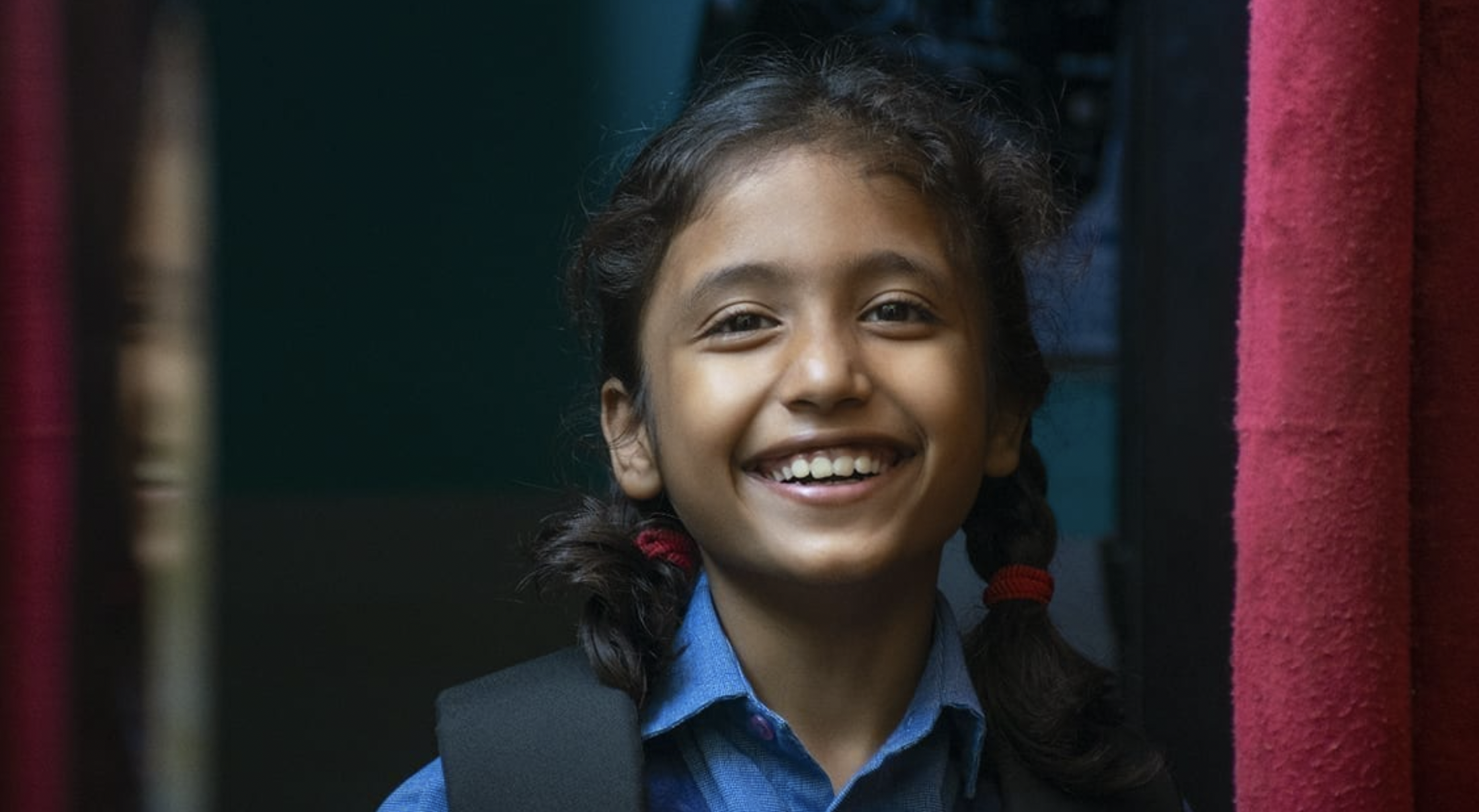 Young school girl smiling