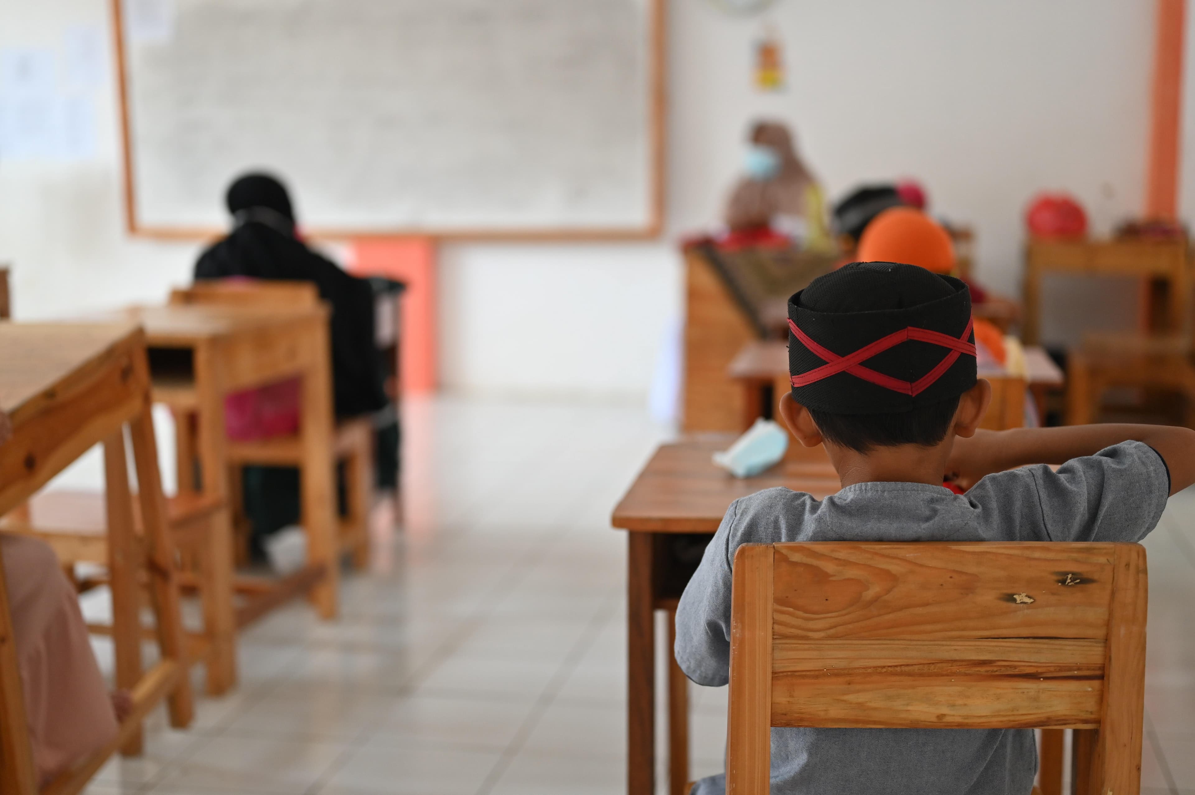 Students sitting at desks in a schools classroom