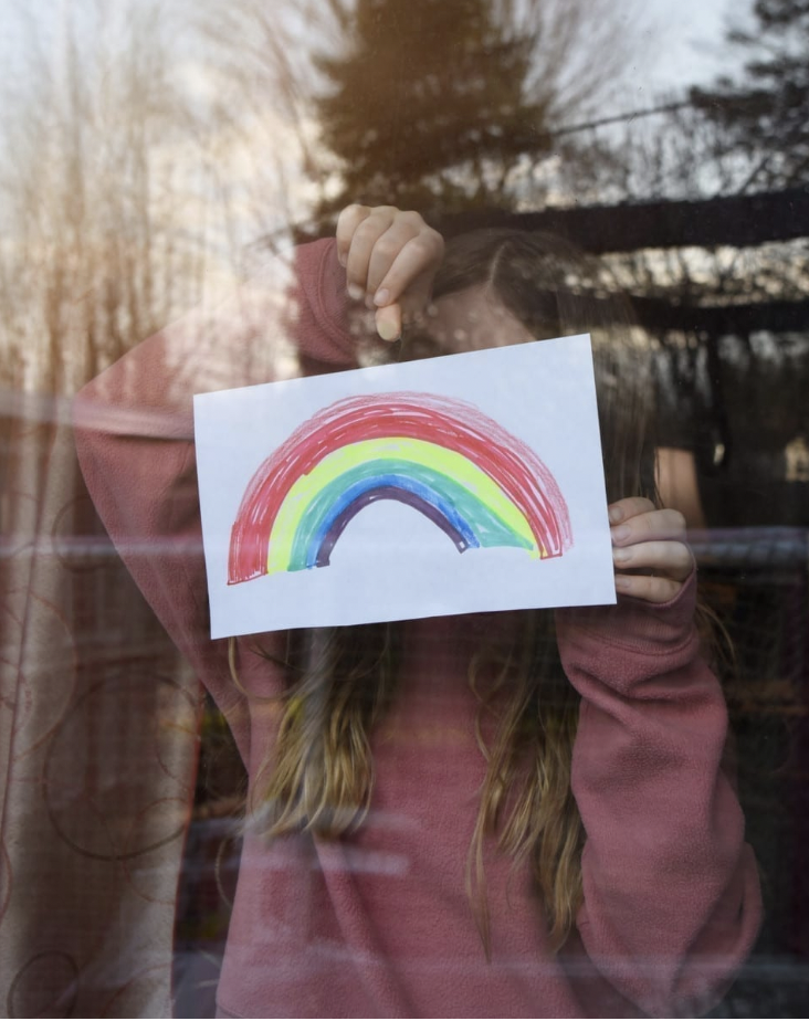 Girl with rainbow drawing