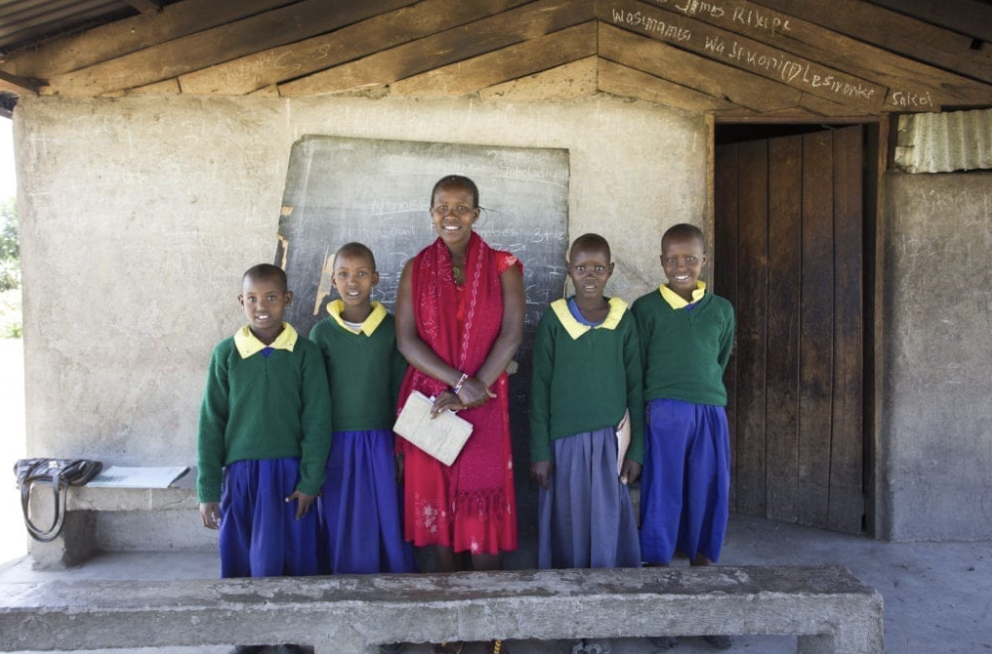 School children standing with their teacher